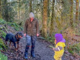 mom hiking with daughter and rottweiler